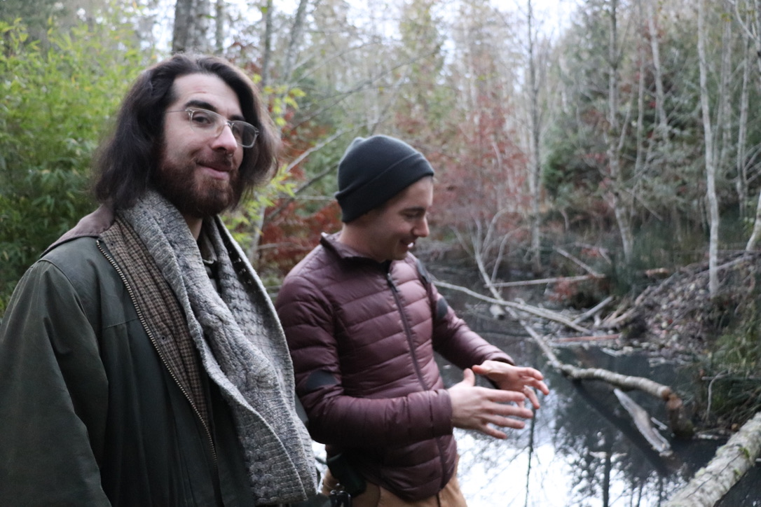 Two science podcasters near a swamp